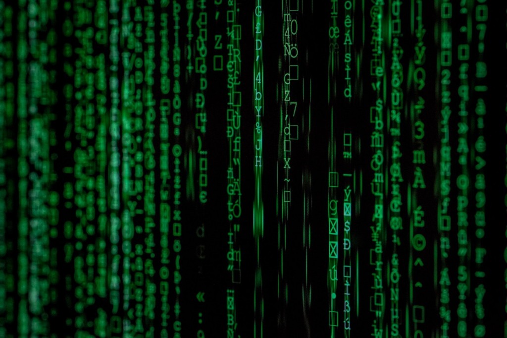 Vertical streams of code.