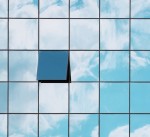 A wall of windows, with one open.