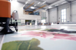 close up of ink jet printing large size image set in a large warehouse room