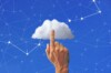 Finger pointing to a cloud with stars on a blue background