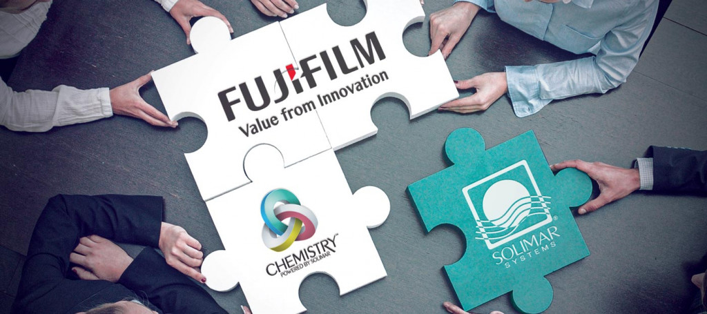 FujiFilm logo on 2 white puzzle pieces Solimar Systems logo on green puzzle piece and Chemistry by Solimar Systems Logo on a white puzzle piece for the partnership