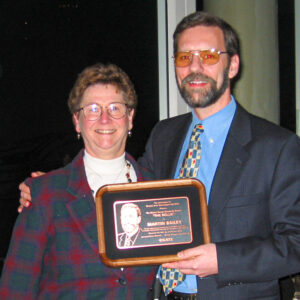 Mary Abbot presenting CGATS Rollie award to Martin Bailey