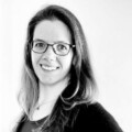 Black and white profile photo of a brunette Caucasian woman.