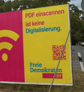 Photo of a billboard including the text "PDF einscanned list keine Digitalisierung. Freie Demokraten FDP.